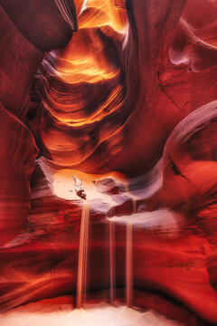 colorful sandstone walls with sandfall in famous antelope canyon - art and travel concept