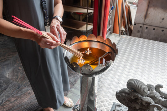 Man Who Lights Incense Sticks At The Hindu Temple In Singapore - Powered by Adobe