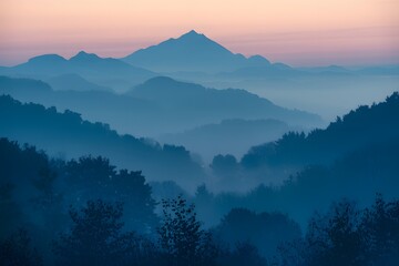 Serene Misty Mountains with Layers of Hills at Dawn or Dusk, Creating a Dreamy and Ethereal Landscape.