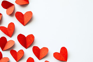 Obraz premium Red paper hearts on a white background. Cute romantic decor for valentine's day, wedding, birthday. Copyspace for your text.