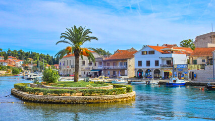 View of the monuments of Vrboska, attractions on the island of Hvar, moored boats in the bay © dominikspalek.pl