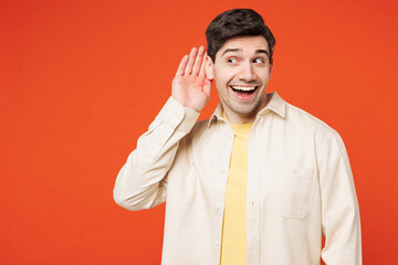 Young happy curious nosy man he wear white shirt yellow t-shirt casual clothes try to hear you...