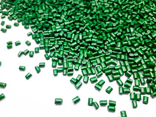 Pearl green masterbatch granules on white background.Color pigment carrier polymer in plastic...