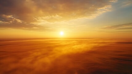 Naklejka premium Aerial shot of the serene Sharga Steppe, with its endless golden plains glowing under the morning sun, in 4K resolution