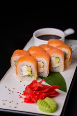 Philadelphia rolls with sauce and red ginger