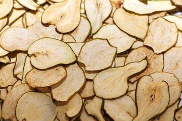 Dried pears, frips, pear slices, dried fruits, pear background, fruit background, selective focus