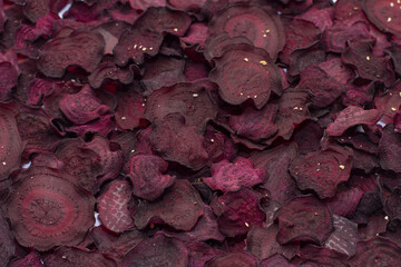 Beet vegetable chips, vegetable background, dried beetroot slices, frips, beet slices, selective focus