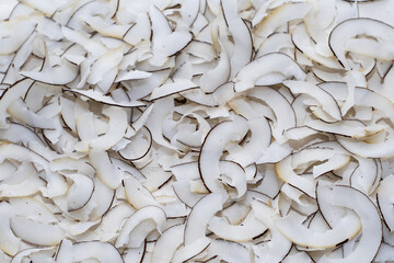 Dried coconut, coconut flakes, coconut chips background, coconut chips, healthy and proper food, selective focus, abstract background