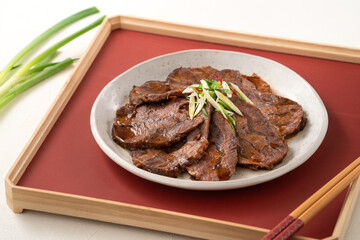 Taiwanese braised beef shank slices in a plate on white table background.
