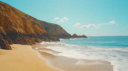 Fototapeta premium Sandy Beach Meets Dramatic Cliffs Ocean View