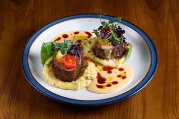 filet mignon with mashed potatoes and cheese sauce