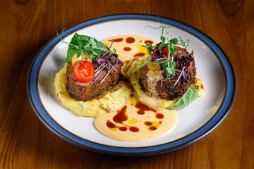 filet mignon with mashed potatoes and cheese sauce