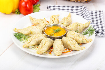 Steamed asian dumpling momo with meat
