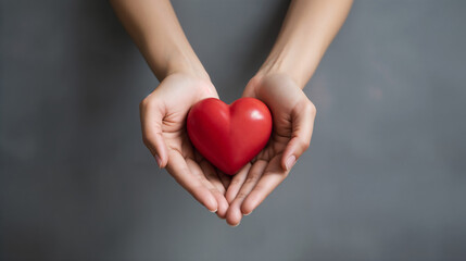 Fototapeta premium Red heart in hands. 