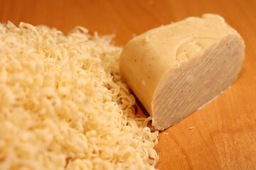 Grated piece of natural laundry soap for washing clothes by hand