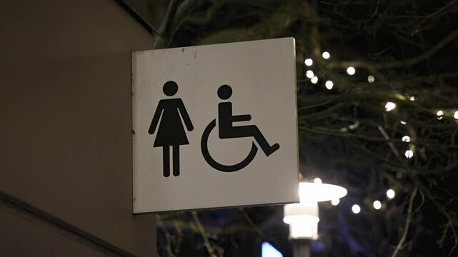 Sign for ladies bathroom with accessibility 