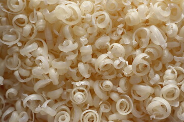 Grated piece of natural laundry soap for washing clothes by hand