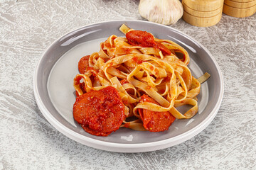 Italian pasta pappardelle with chorizo