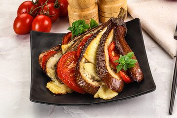 Baked tomato with mozzarella and tomato