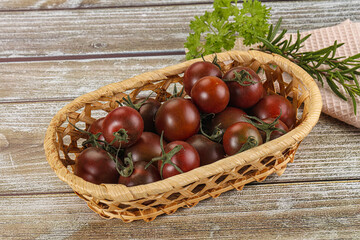 Juicy ripe black cherry tomato