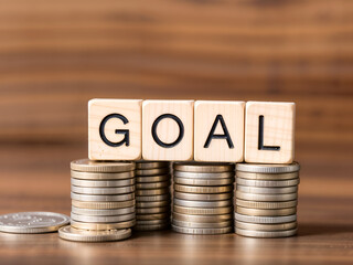 Wooden blocks spelling "goal" stacked on coins, symbolizing financial planning, motivation, and success. Ideal for investment and savings concepts. Generative AI