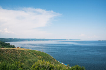 View of the Volga River in Tatarstan, Russia. Endless blue river in summer. Calm natural landscape.