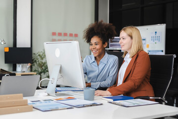 Diverse professionals collaborate on project analysis with financial graphs. Strategic teamwork and insights drive company growth and success.