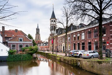 Fototapeta premium Cityscapes of the medieval town with canal, medieval house, and Onze Lieve Vrouwetoren (Church tower) view on Amersfoort