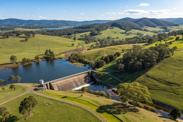Fototapeta premium Australian Farm Dam Aerial View: Lush Green Fields, Trees, Water Reservoir