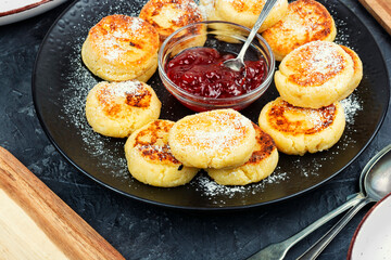 Cottage cheese pancakes or curd fritters stack.
