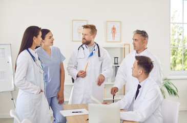 Team of doctors and nurses participating in a working meeting or conference in the hospital office....