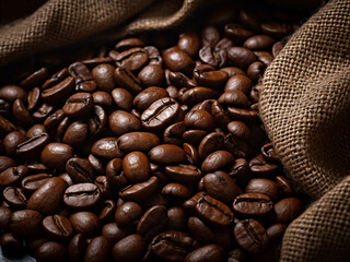 Coffee beans scattered on a sackcloth background