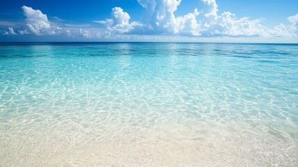 Fototapeta premium Beach with clear water invites relaxation and enjoyment. The serene beach experience promises rejuvenation, surrounded by stunning clear water, making it an ideal beach retreat.