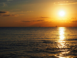 Warm afterglow of sunset at the horizon. from the beach of Gallipoli, Apulia, Italy.