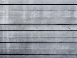 Striped gray concrete wall with a modern textured background