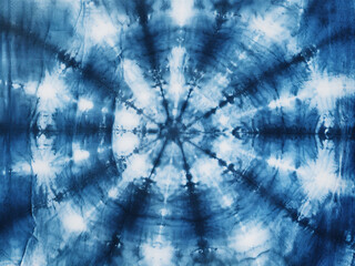 Fototapeta premium Indigo-dyed local fabric with a tie-dye pattern on cotton creating an abstract background