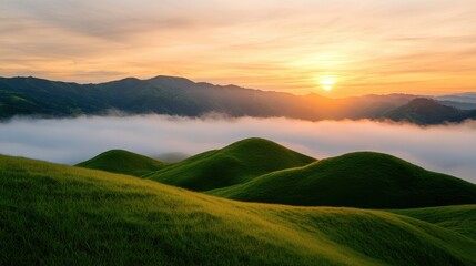 Naklejka premium Serene Sunset Over Rolling Green Hills and Misty Valleys