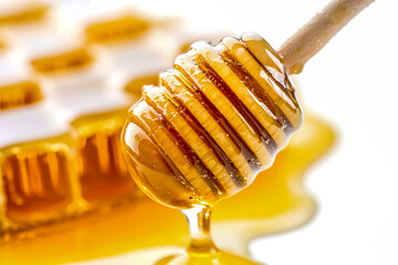 Close-up of dripping honey isolated on a white background with clipping path.