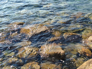 Sea stoney beach, close-up. Stone coastline. Sun seascape for publication, poster, calendar, post, screensaver, wallpaper, postcard, banner, cover, website. High quality photo