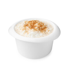 Delicious rice pudding with cinnamon isolated on white