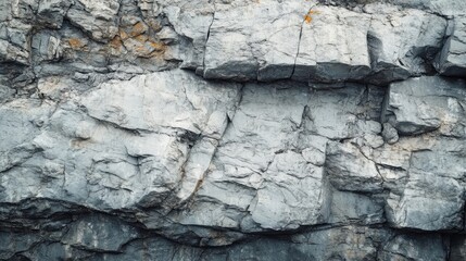 Fototapeta premium White stone grunge background with rough rock wall texture for an earthy and raw aesthetic