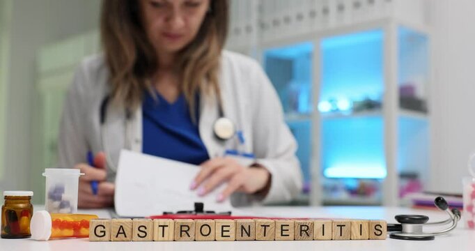 In a medical environment, a healthcare professional thoroughly examines various documents related to gastroenteritis