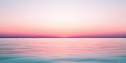 Obraz premium Serene Sunrise Over Calm Seascape with Pastel Hues