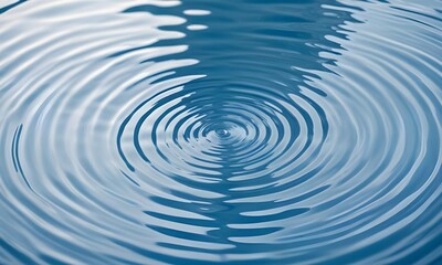 Fototapeta premium Concentric blue ripples on a light background , suggesting a calm water surface