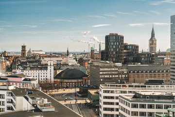 Copenhagen city with business building, clock tower, church, castle on sunny day at Denmark