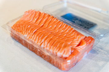Fresh raw salmon fish seafood slices in package