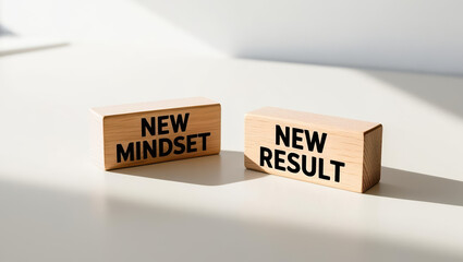 New mindset and new result concept displayed on wooden blocks in bright light, symbolizing positive change, growth, and motivation for success in business and personal development