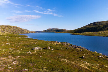 Fototapeta premium Blue sky over a lake in the tundra.