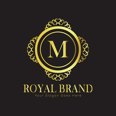 Letter M Luxury brand logo design with a royal gold crown emblem and elegant typography
