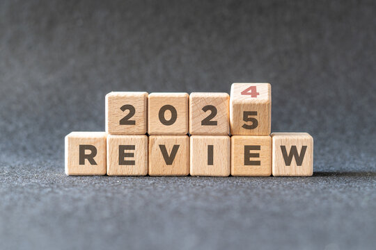 2024 business and customer review for business strategic planning in the next year 2025. Flipping of 2024 to 2025 on wooden blocks. End of the year business concept.
